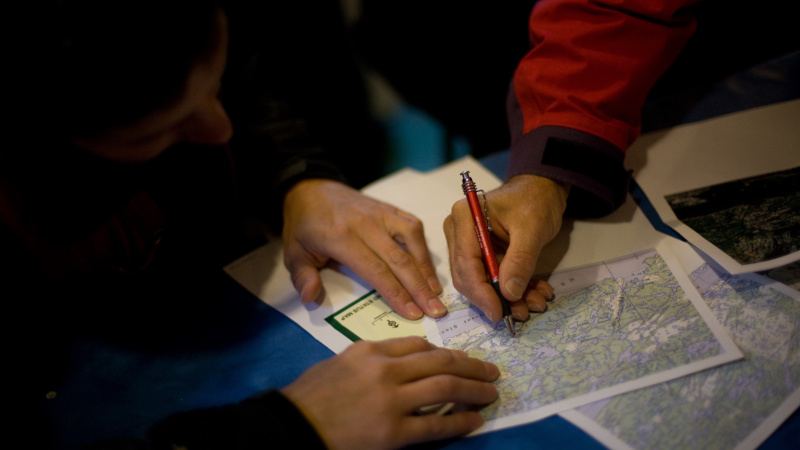 Two people examining a map
