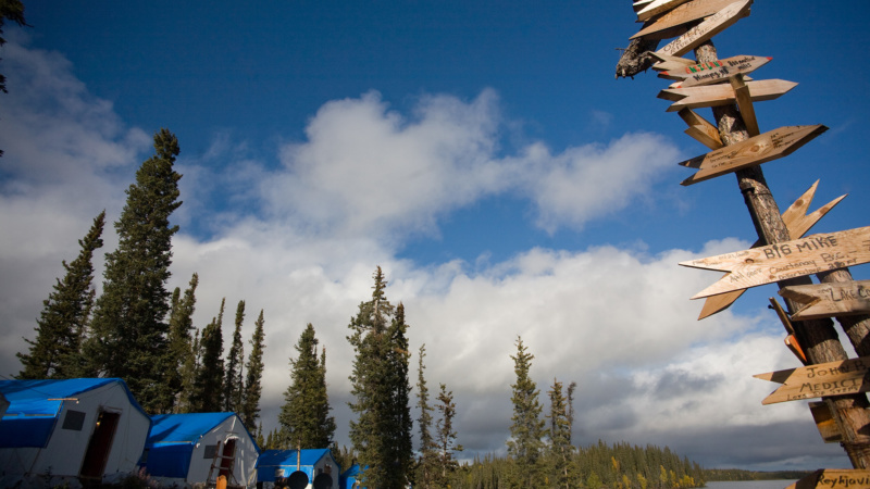 A sign post in front of living quarters at Thor Lake